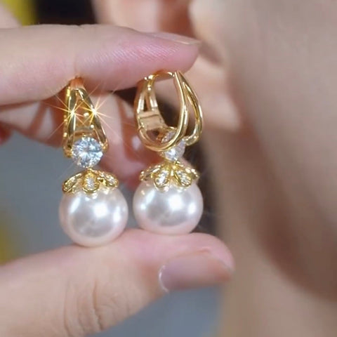 Boucles d'oreilles dorée en perle argenté