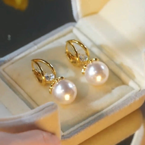 Boucles d'oreilles dorée en perle argenté