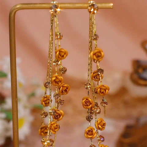 Boucles d'oreilles longues à pompons roses marron pour femmes