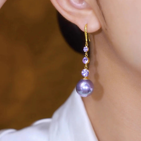 Boucles d'oreilles longues en perles violettes