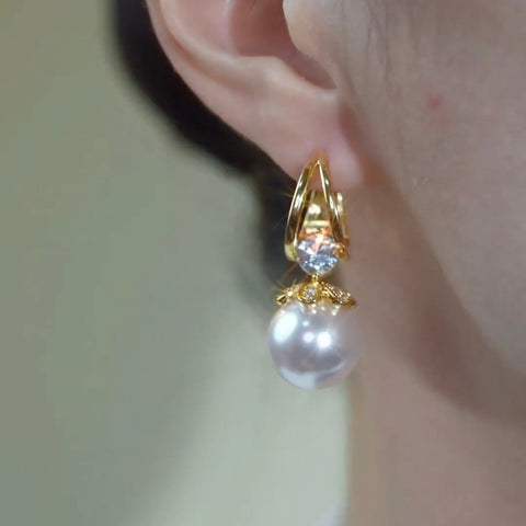Boucles d'oreilles dorée en perle argenté