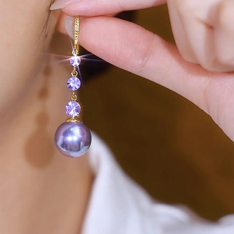 Boucles d'oreilles longues en perles violettes