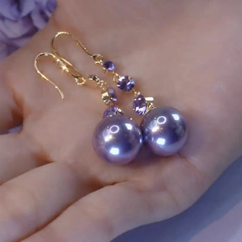 Boucles d'oreilles longues en perles violettes