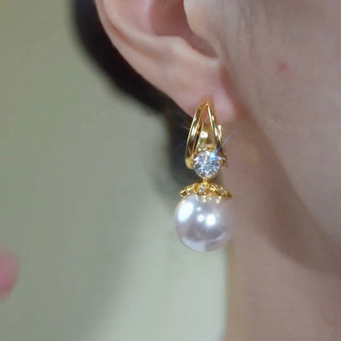 Boucles d'oreilles dorée en perle argenté